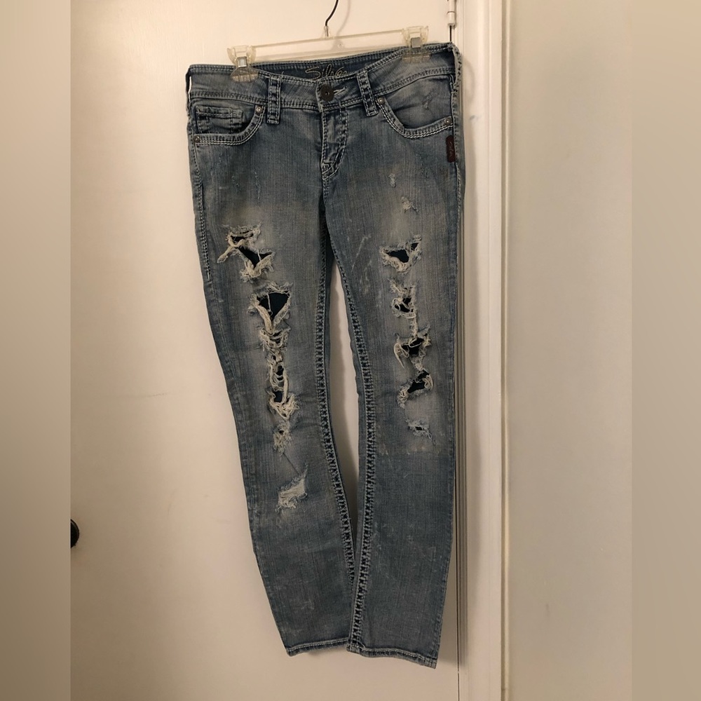 Silver distressed low rise skinny jeans